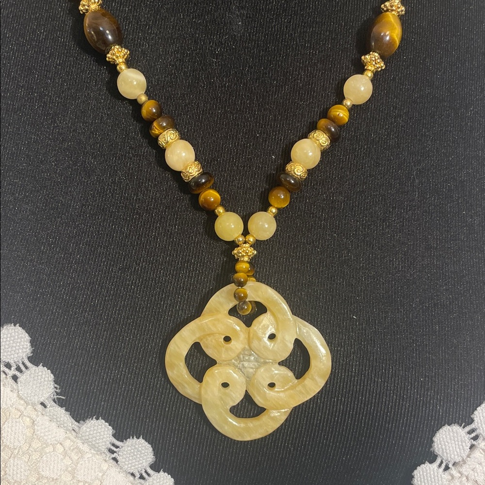 Vintage Tiger eye necklace with a carved yellow, jade pendant in an endless knot